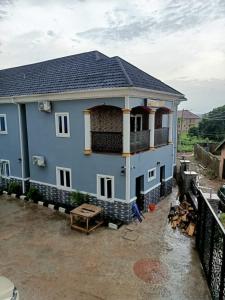 a house under construction with a roof at Paviosca Hotel in Umuahia