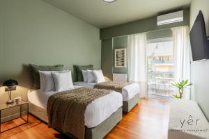 a bedroom with two beds and a balcony at Luxury Flat w/2Bath - Private Parking @Pasalimani in Piraeus
