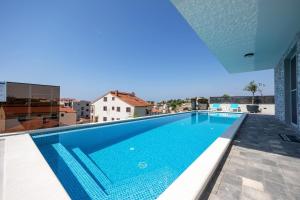 Gallery image of Apartman Oliva and Studio Delux for a family with swiming pool, free parking, terace with view at the sea in Podstrana