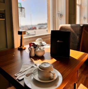 a table with a laptop computer on top of it at Marina Court in Weymouth