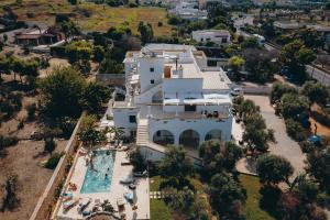 an aerial view of a house with a swimming pool at Il Torrino B&B in Sannicola +29 photos