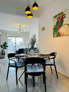 a dining room with a table and chairs in a room at HAYDEN HOME in Libreville