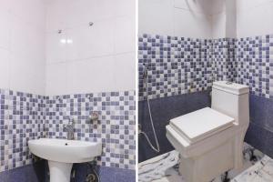 ein Bad mit einem WC und einem Waschbecken in der Unterkunft FabExpress King Stay in Neu-Delhi