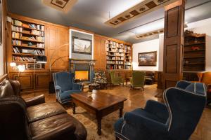 a living room filled with furniture and a fireplace at Duca D'Aosta Hotel in Aosta