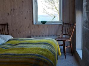 Rúm í herbergi á Guesthouse Nýp