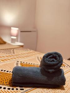 a towel sitting on top of a table at Cocon Flânerie & Bambou in Joigny