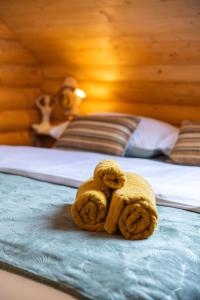 a monkey cookie sitting on top of a bed at Kuća DORINE in Fužine