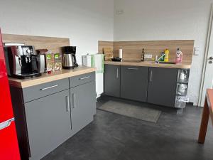 a kitchen with a sink and a counter top at Villa Schaumburg - Boutique Hotel in Rinteln