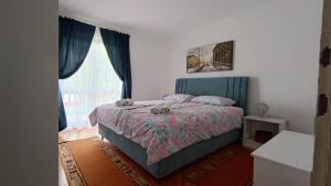 Postel nebo postele na pokoji v ubytování Apartments Gabriela