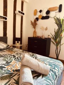Ένα ή περισσότερα κρεβάτια σε δωμάτιο στο Cocon Bois-Joly