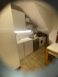 a small kitchen with a sink and a microwave at I nespoli in Imola