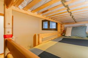 a bedroom with a bunk bed in a house at Templo cota 2330m in Sierra Nevada