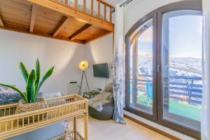 a living room with a large sliding glass door at Templo cota 2330m in Sierra Nevada