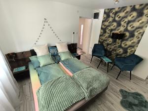 a living room with a bed and a couch at Csillagom in Szeged