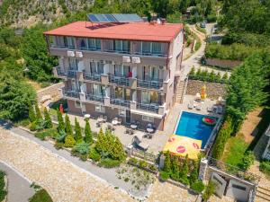 an aerial view of a building with a swimming pool at Villa Tesla in Ohrid
