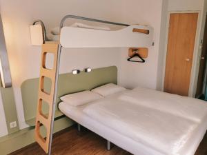 Krevet ili kreveti u jedinici u objektu ibis budget Berlin Ost