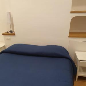 Posteľ alebo postele v izbe v ubytovaní Penisola Home Experience