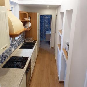 Kuchyňa alebo kuchynka v ubytovaní Penisola Home Experience