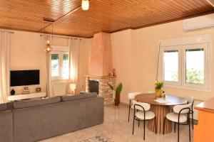 a living room with a couch and a table at Kentos Airy & Fully Equipped 3BR Family Maisonette in Chios