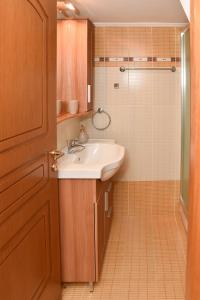 a bathroom with a sink and a shower at Kentos Airy & Fully Equipped 3BR Family Maisonette in Chios +31 photos