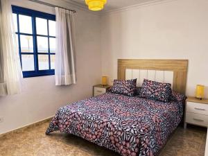 Ένα ή περισσότερα κρεβάτια σε δωμάτιο στο Jardín Del Sol Home