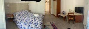 a bedroom with a bed and a desk and a television at Lilli's House in Gallipoli