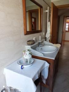 a bathroom with a sink and a mirror at ROOM AURORA in Fiera di Primiero