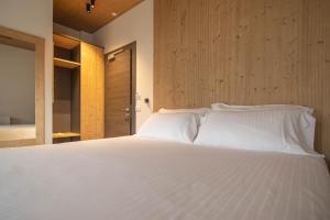 Postel nebo postele na pokoji v ubytování Chalet Cridola Dolomiti Experience