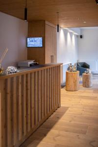 TV a/nebo společenská místnost v ubytování Chalet Cridola Dolomiti Experience