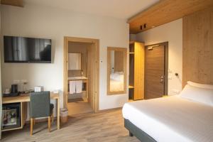 Postel nebo postele na pokoji v ubytování Chalet Cridola Dolomiti Experience