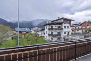 a view of a city with houses and a bridge at Chalet Cridola Dolomiti Experience in Lorenzago