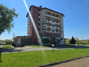 a water fountain in front of a building at Mayberry Highway - Apartmani Medijapark in Sveti Nikole
