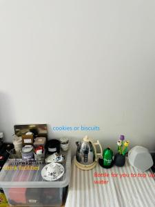 a drawer filled with pots and pans and other items at Your ideal ExCel London- O2 Arena - LCY Airport homestay in Barking