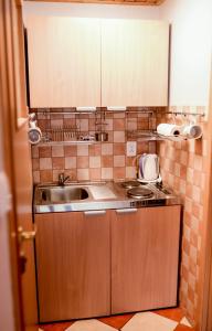 a kitchen with a sink and a counter top at Apartament EmKa z balkonem Rowy in Rowy