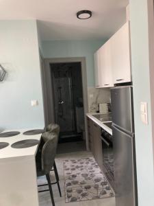 Kuchyň nebo kuchyňský kout v ubytování VALANTIS home