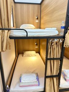 a small room with two bunk beds on a boat at A.MING Backpacker & Tours Điện Biên in Dien Bien Phu