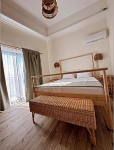 a bedroom with a wooden bed and a window at B'LEK SEA RESORT in 2 Mai