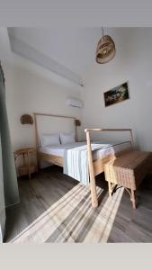 a bedroom with a bed and a table in it at B'LEK SEA RESORT in 2 Mai +90 photos