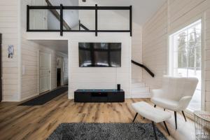 Et tv og/eller underholdning på Holiday in Lapland - Villa Lapintuuli + 20 billeder