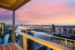 a view of a city from a balcony of a building at Sub-penthouse Stunning With Water Frontage 3B2B1C in Melbourne