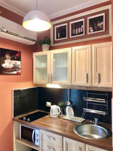 a kitchen with a sink and a counter top at Apartments DS Club in Budva
