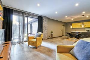 a living room with a couch and a table at Loft 1502 in Antalya