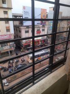 a view from a window of a busy city street at UK YATHRINIVAS in Udupi