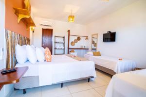 Pousada Solarium de Gostoso客房内的一张或多张床位
