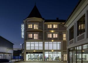 a store front of a building at night at Sagora Hotel in Chernivtsi