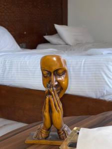 a statue of a head on a table in a bedroom at Queen cleopatra sphinx view in Cairo