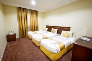 Кровать или кровати в номере Hotel Apartments