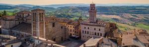 an aerial view of a castle with mountains in the background at S. Bartolomeo II° - "La Loggetta" in Montepulciano