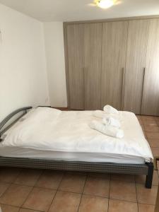 Ένα ή περισσότερα κρεβάτια σε δωμάτιο στο Vacanza a Miglieglia