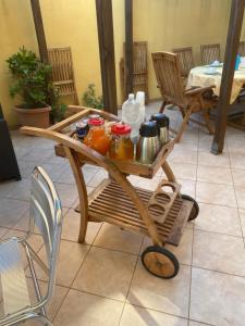 a wooden cart with pots and pitchers on it at Le tre terrazze - Gallipoli in Gallipoli +18 photos
